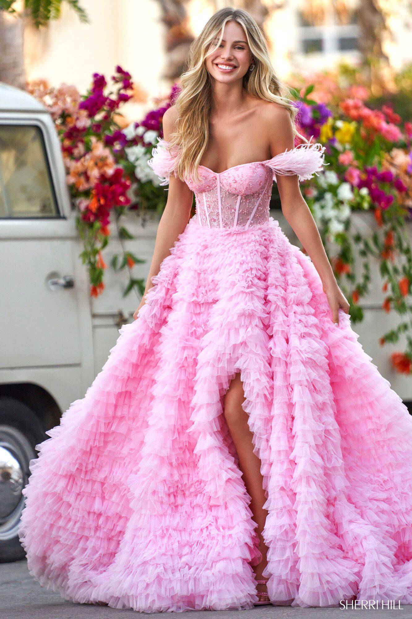 Model wearing pink Sherri Hill dress